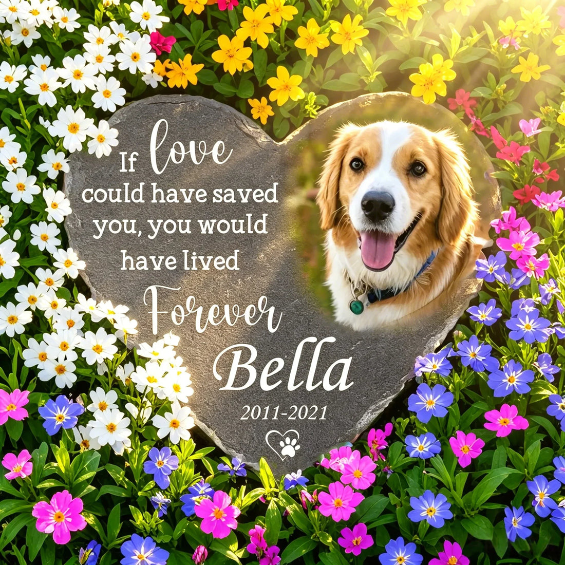 Heart-shaped personalized dog memorial stone surrounded by colorful garden flowers, engraved with golden retriever photo, pet name Bella and memorial quote, vertical blog cover for pet loss garden tribute guide